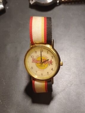 Hard Rock Time Gold-Tone Watch with Red, Yellow, Black Stripe Strap